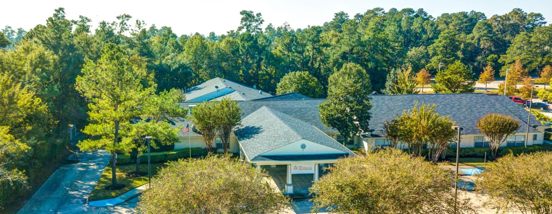 a clubhouse with trees around it